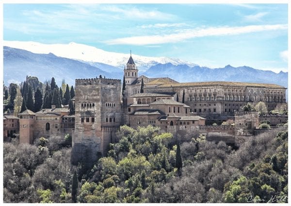 Artistic colour photo print of the Alhambra in Granada, Spain against snow capped mountains.