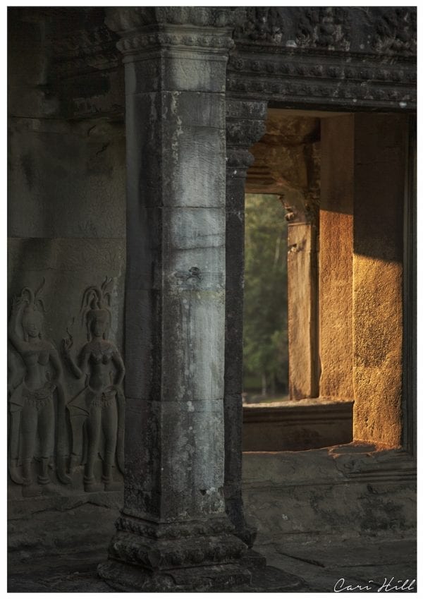 Artistic photo print of sunlight streaming through the ancient ruins of Angkor Wat temple in Siem Riep, Cambodia.