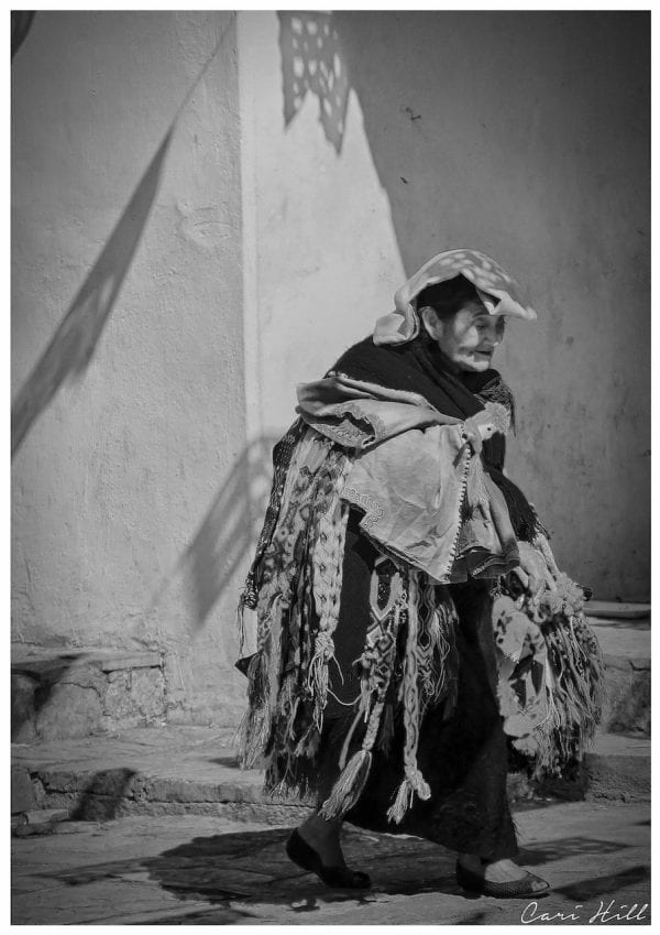 Artistic B&W photo print of a lady carrying many scarves for sale in San Cristobal, Mexico.