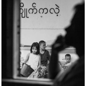 Artistic B&W photo print of a family outside a train window framed by a silhouette in Yangon, Myanmar (Burma).