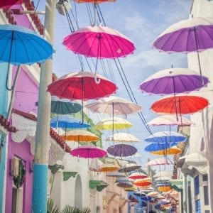 Artistic colour photo print of an alley of colourful umbrellas in Cartagena, Colombia.
